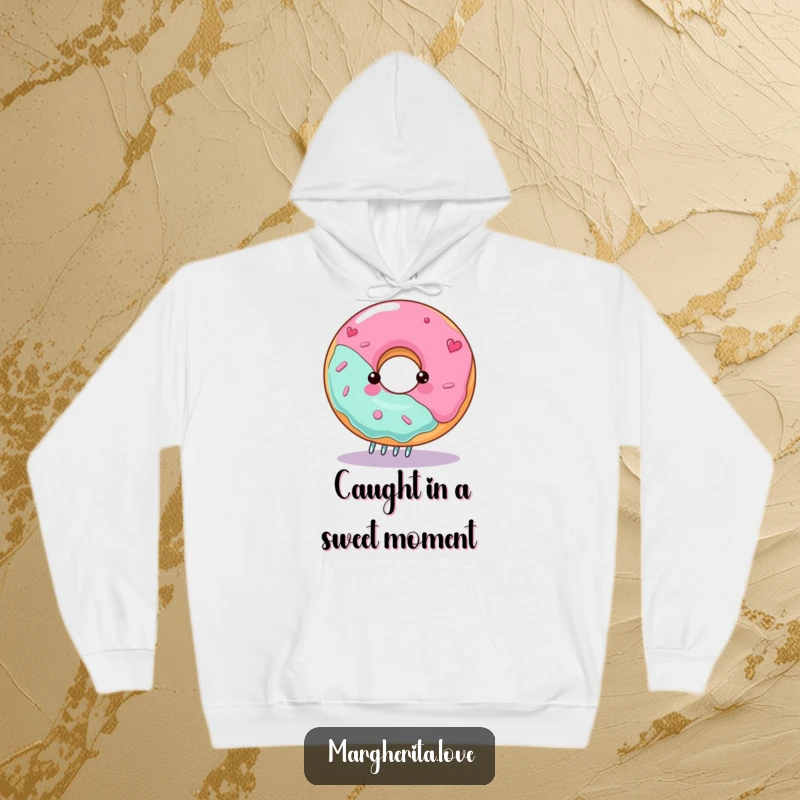 Funny donut hoodie with a gleeful character spinning on a fork, offering warmth and playful charm.